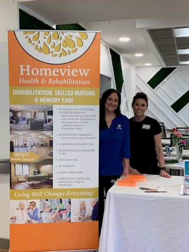 Staff members represent Homeview at a healthcare event.