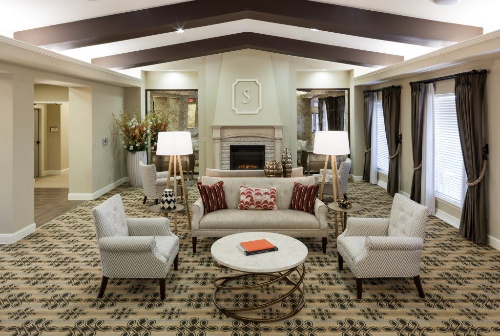 A cozy living room with elegant furniture and a fireplace.