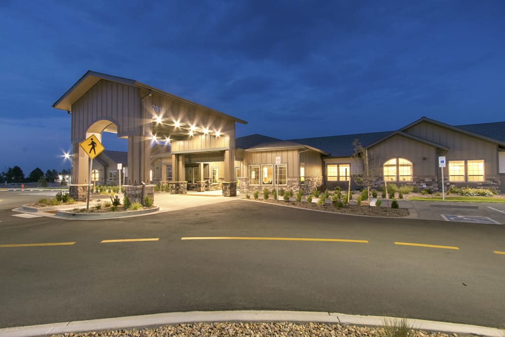 A well-lit building entrance at night.