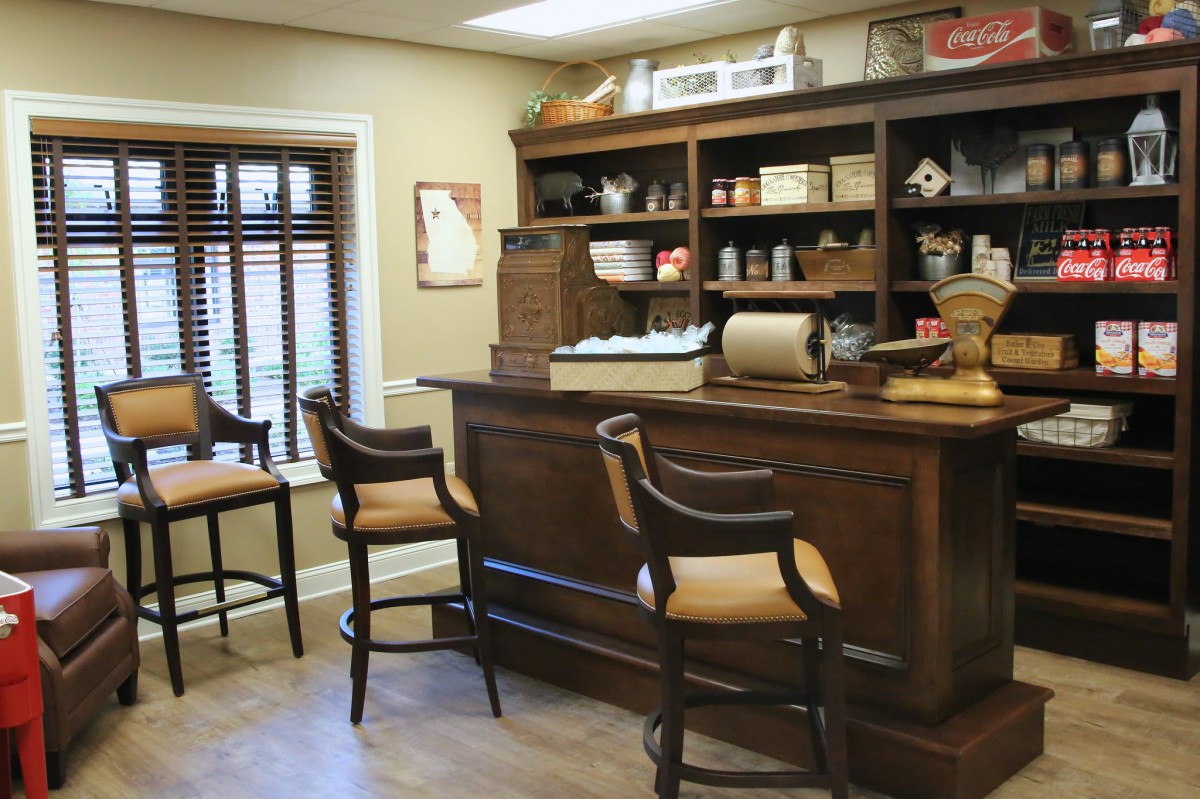 A cozy vintage-style bar area with wooden furniture and antique decor.