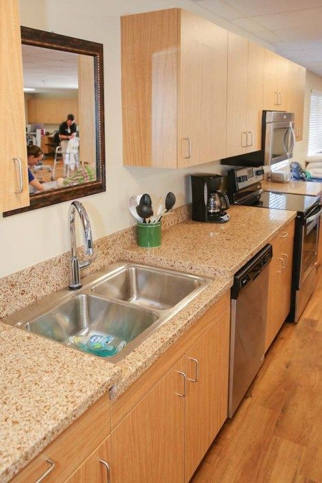 Modern kitchen with granite countertops and stainless steel appliances.