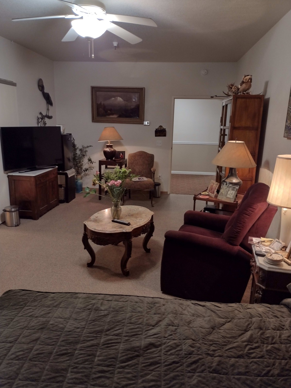 Cozy living room with comfortable seating and ambient lighting.