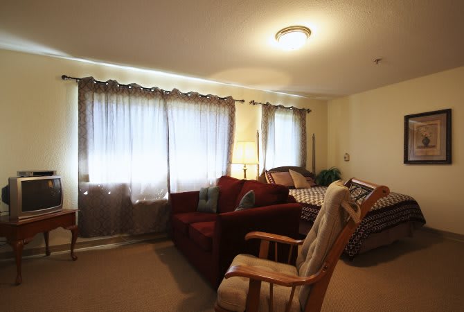 A cozy living room with comfortable furniture and soft lighting.