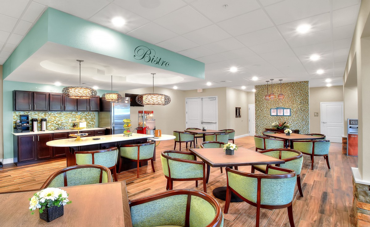 A modern dining area with elegant seating and stylish lighting, creating a cozy atmosphere.