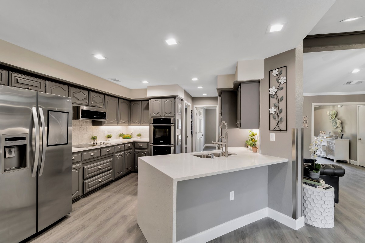 A modern kitchen with sleek appliances and a spacious island.