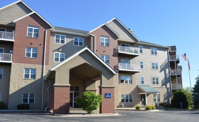 A multi-story hotel building with a prominent entrance canopy.
