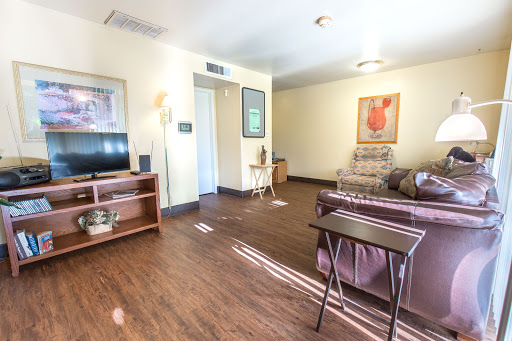 A cozy living room featuring comfortable furniture and warm lighting.