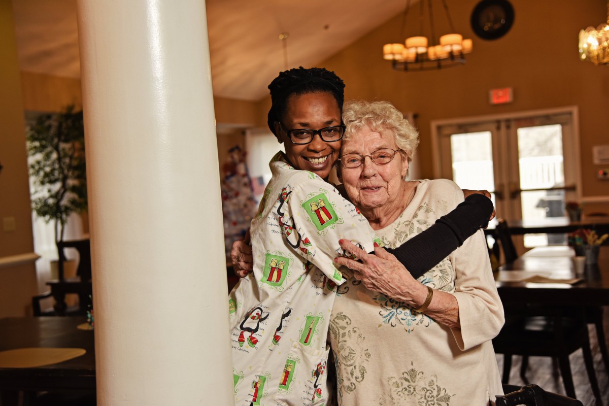 A joyful moment shared between two people embracing indoors.