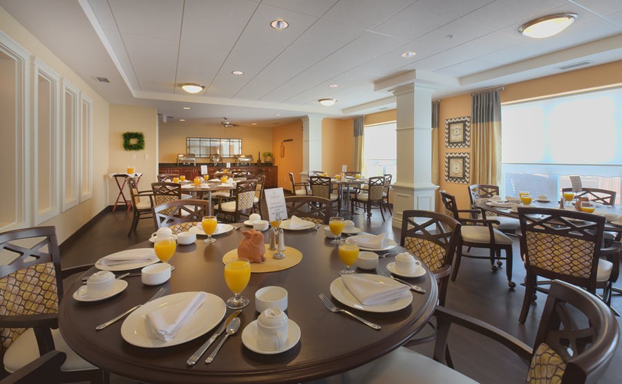 A beautifully set dining room table ready for breakfast service.