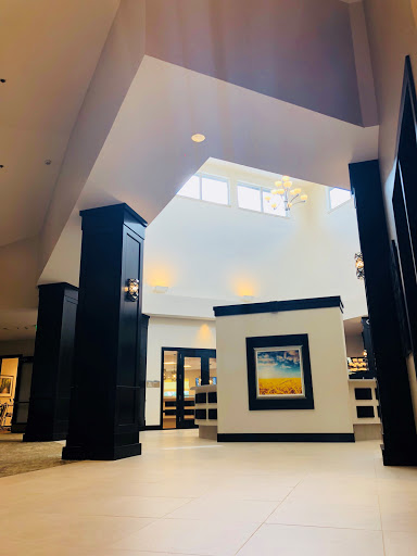 A modern lobby showcasing elegant architecture and ample natural light.