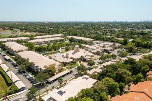 Aerial view of a suburban residential area with trees and buildings.