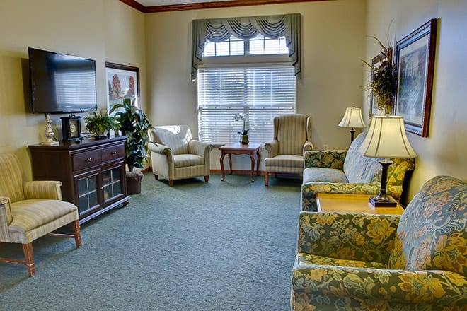 A cozy living room with comfortable seating and natural light.