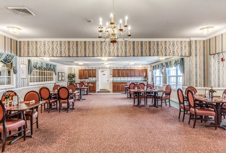A spacious dining room with elegant decor and ample seating.