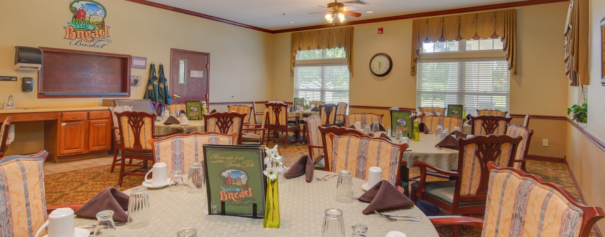 Cozy restaurant dining area with neatly arranged tables and chairs.