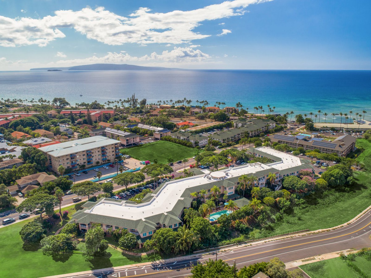 Aerial view of a beachfront resort with ocean in the background.