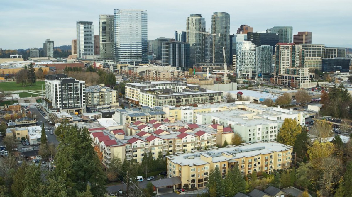 A bustling urban cityscape with a mix of modern skyscrapers and residential buildings.
