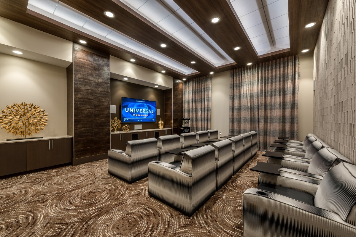 A luxurious home theater with plush seating and ambient lighting.