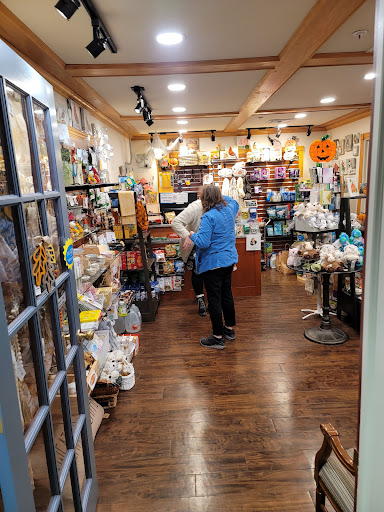 A cozy shop filled with a variety of merchandise and customers browsing.