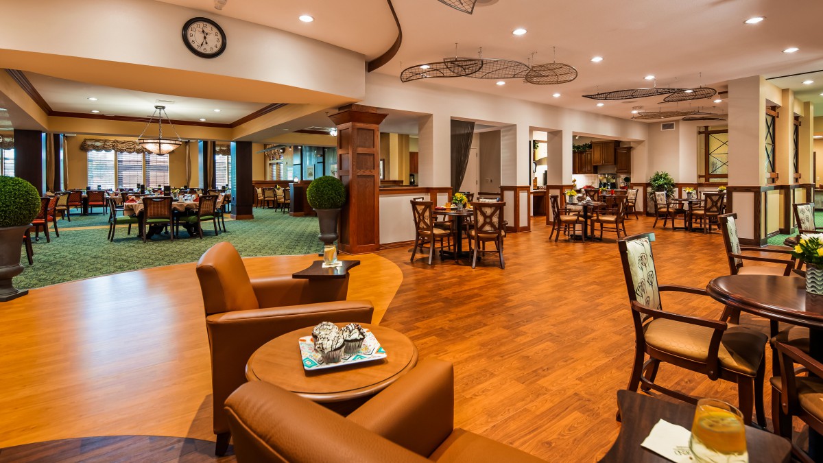 A cozy restaurant interior with warm lighting and comfortable seating arrangements.