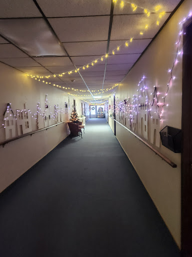 A beautifully decorated hallway illuminated with fairy lights, creating a warm and festive atmosphere.