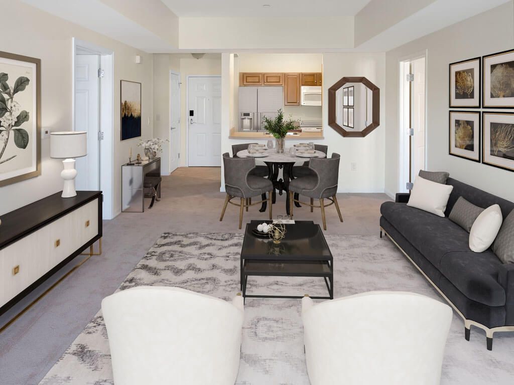A modern open-concept living and dining area with neutral tones and contemporary furnishings.