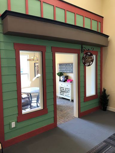 An inviting entrance to a well-decorated space featuring green and red accents.