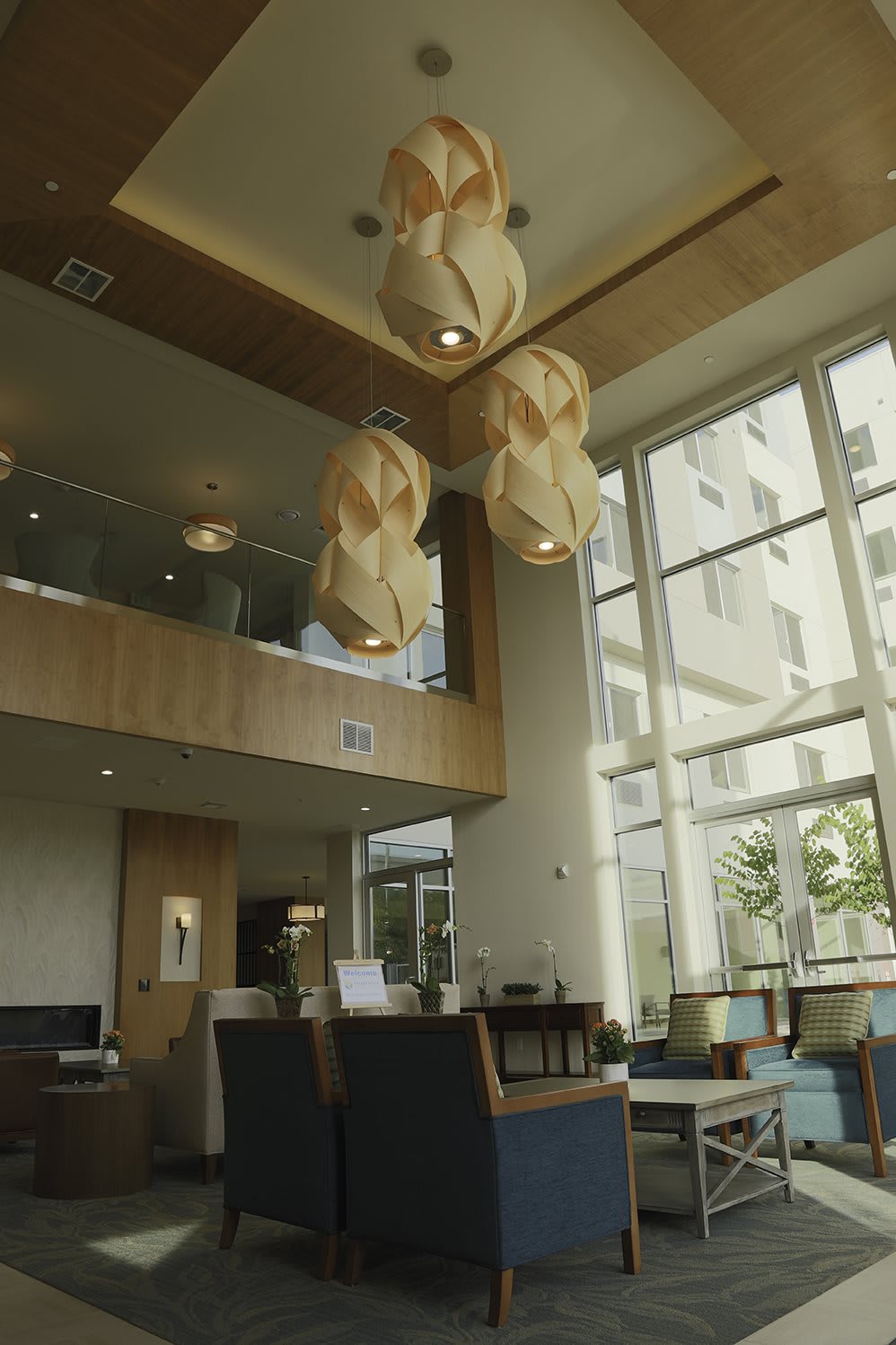 A modern lounge area with stylish lighting and large windows.