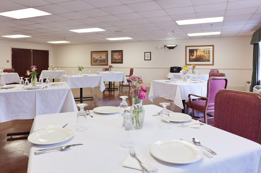 A beautifully arranged dining room with elegant tables set for guests.