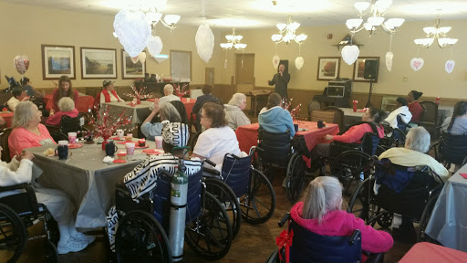 Seniors enjoying a community gathering in a cozy indoor space.