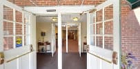 Open doorway leading into a building's hallway.