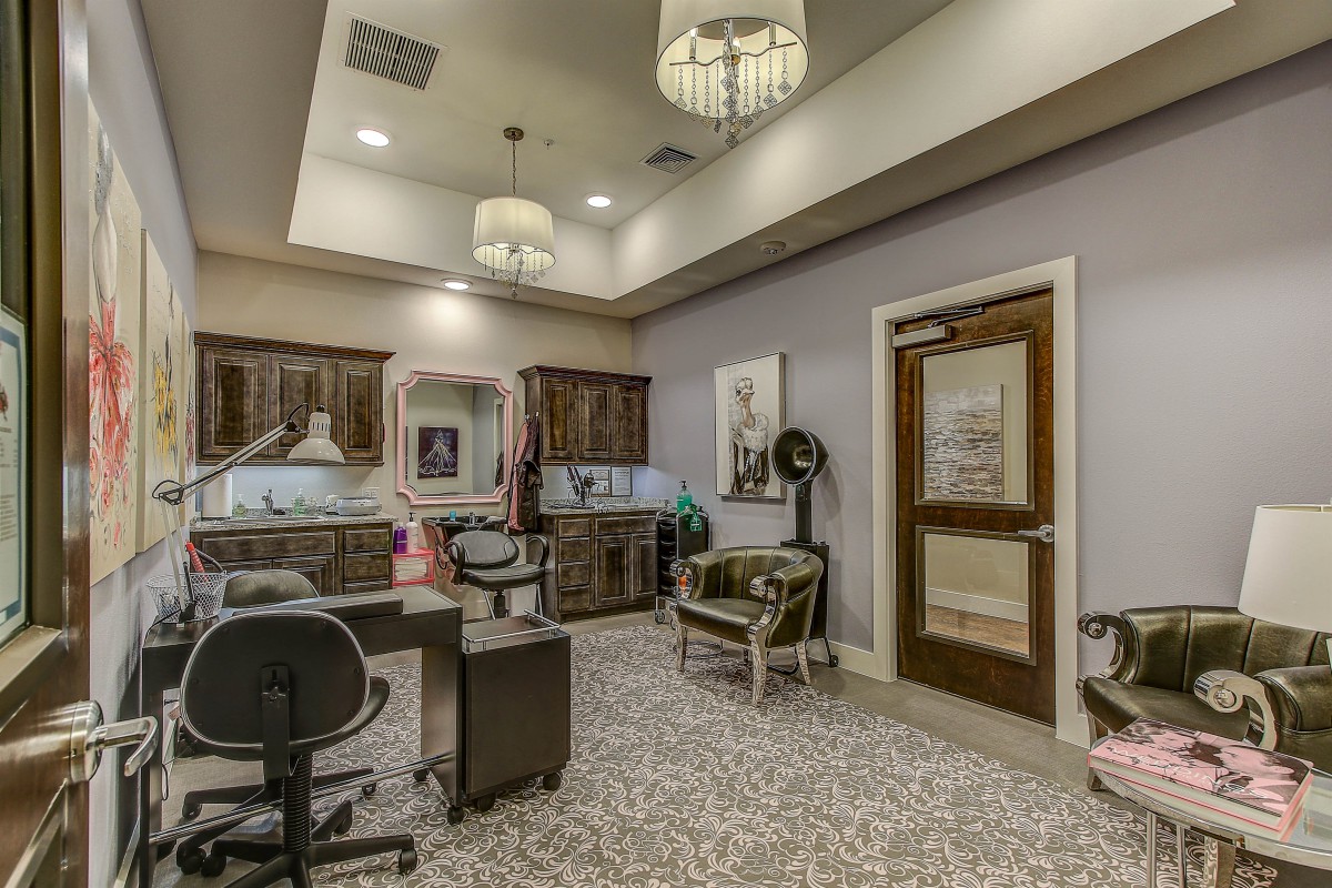 A well-designed office interior featuring elegant furniture, decorative elements, and ample lighting.