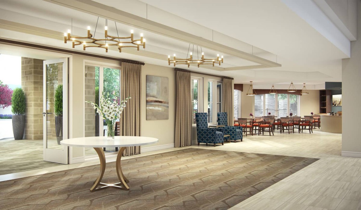 A spacious, modern living room with elegant decor and large windows.