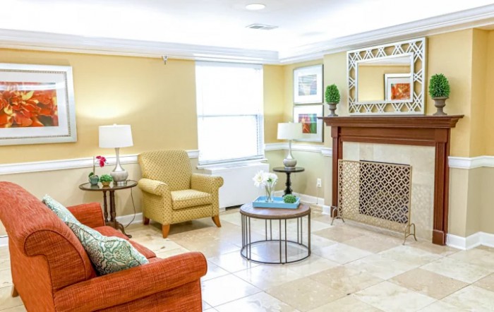 A cozy living room with comfortable seating and elegant decor.