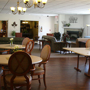 A cozy lounge and dining area featuring elegant furniture and warm lighting.