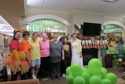 A joyful gathering in festive costumes, celebrating together with colorful decorations.