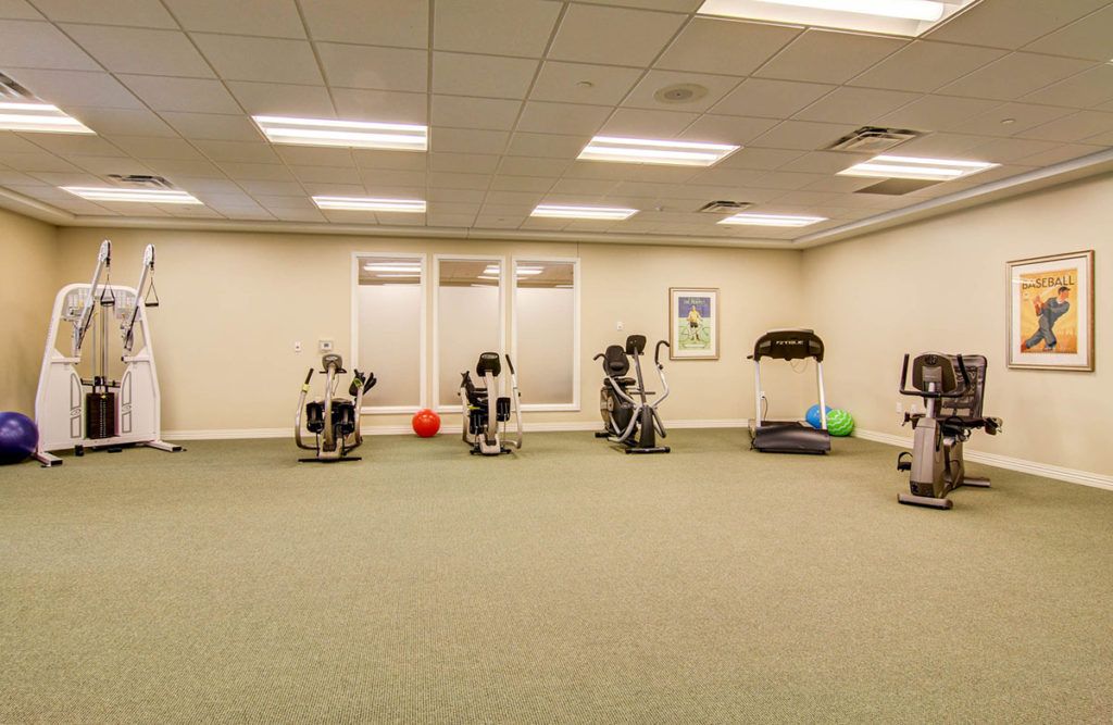 An indoor gym with exercise equipment and fitness machines.