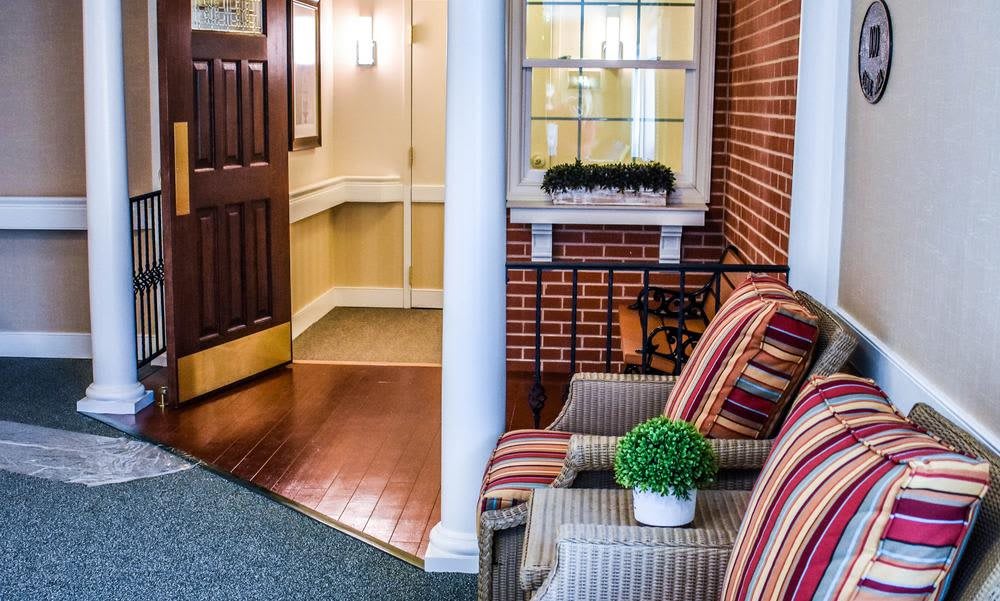 A cozy entrance with comfortable seating and stylish decor.