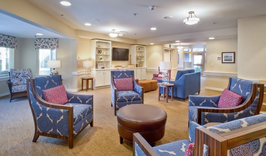 A cozy living room with comfortable seating and a television setup.