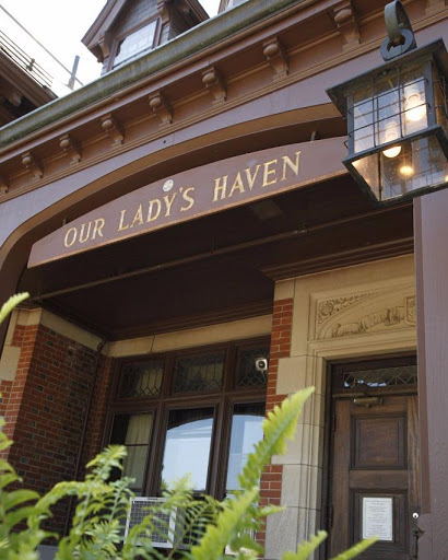Entrance of Our Lady's Haven showcasing architectural details.