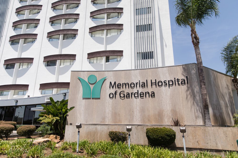 The exterior view of Memorial Hospital of Gardena with its prominent sign.