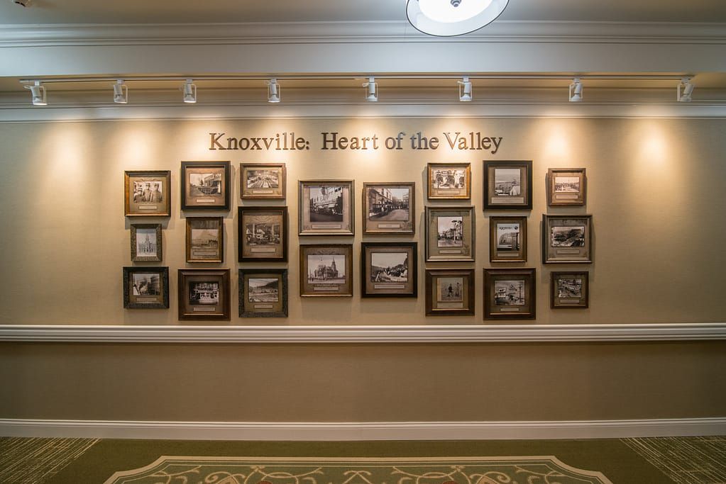 A wall display titled 'Knoxville: Heart of the Valley' featuring a collection of historical photographs.