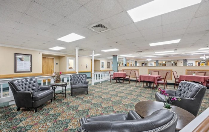 A spacious lobby with comfortable seating and patterned carpet.