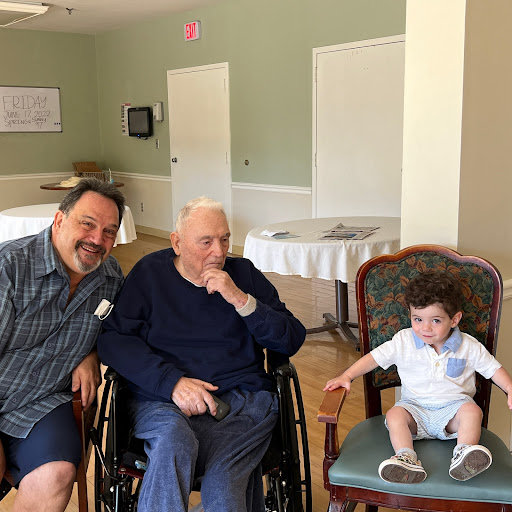 A heartwarming moment shared among three generations, capturing the joy of family.