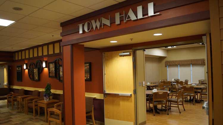 Entrance to a town hall with visible interior seating.