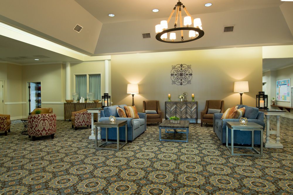 A well-appointed living room with comfortable seating, elegant lighting, and tasteful decor.