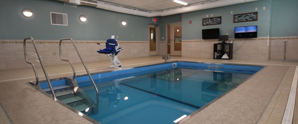 An indoor swimming pool equipped with an accessibility lift.