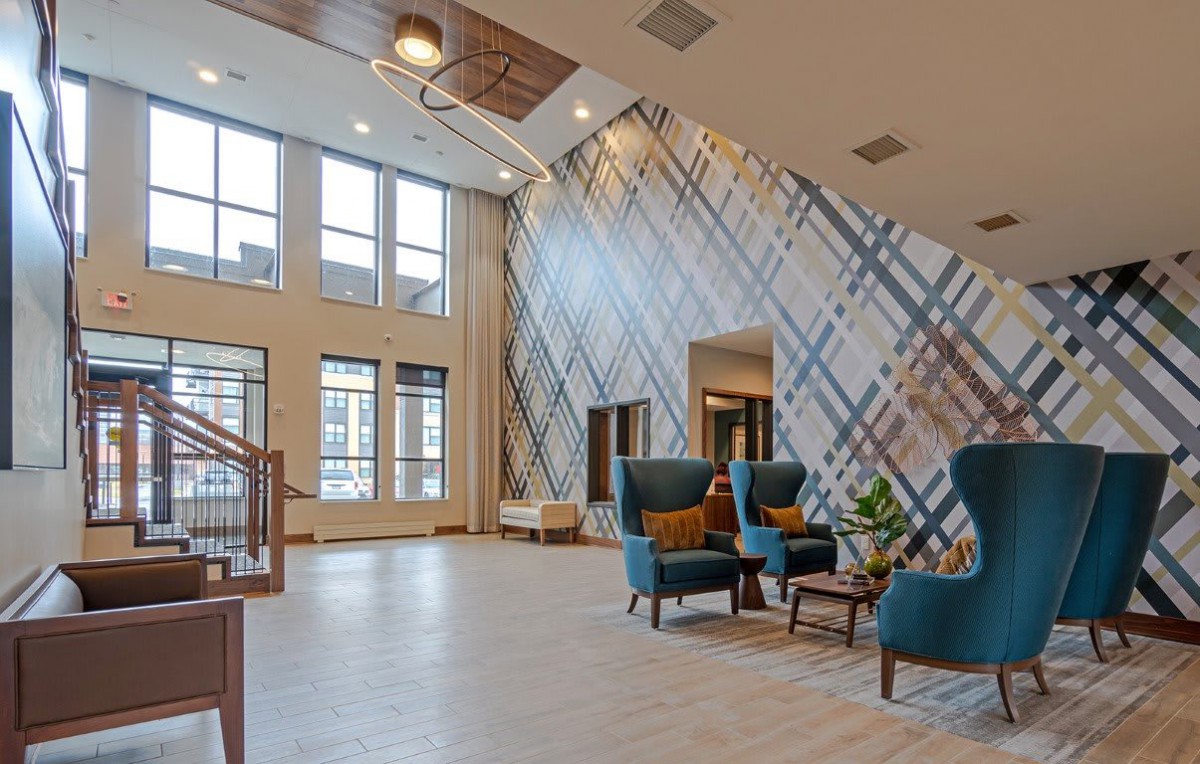 A modern lobby with stylish furnishings and large windows.