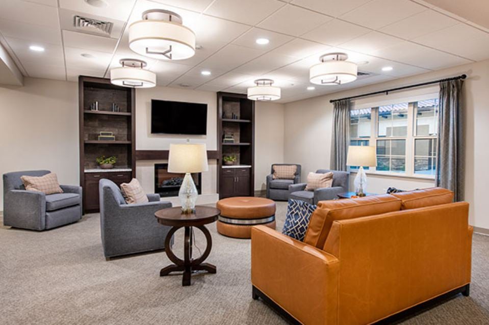 A modern living room with comfortable seating and stylish lighting.