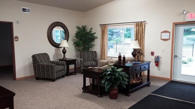 A cozy living room with elegant furnishings and natural light.