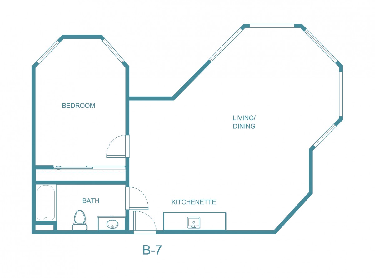 A floor plan featuring a bedroom, living/dining area, kitchen, and bathroom.